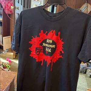 Black Graphic Homecoming T‑Shirt with Red and Yellow Print
